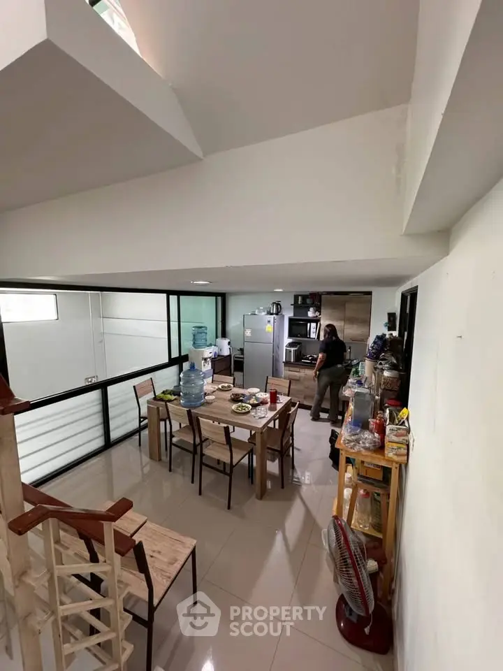 Spacious kitchen with modern appliances and dining area in open layout