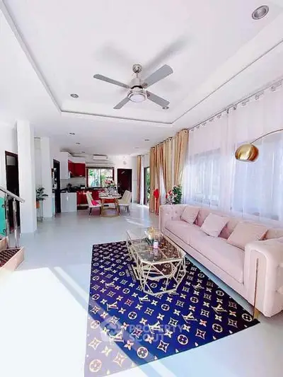 Luxurious living room with designer decor and open kitchen layout