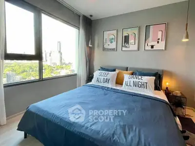 Modern bedroom with large windows and stylish decor in urban apartment