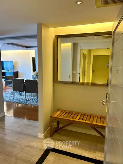 Modern apartment entrance with view into stylish living room