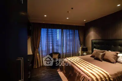 Luxurious bedroom with elegant decor and ambient lighting in modern apartment.