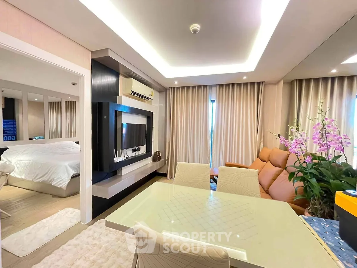 Luxurious modern living room with elegant dining area and cozy bedroom view