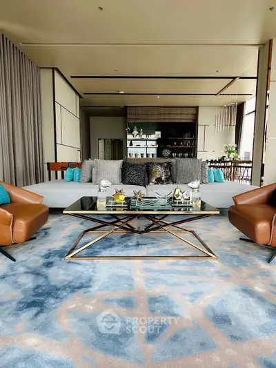 Luxurious modern living room with elegant decor and spacious seating area.
