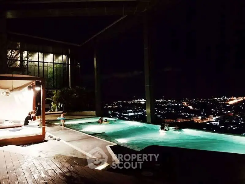 Luxurious rooftop infinity pool with stunning city night view