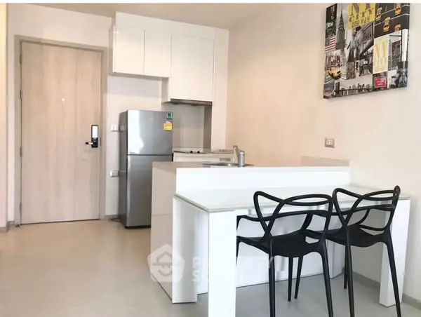 Modern kitchen with sleek design and dining area in stylish apartment