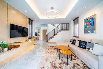 Luxurious modern living room with stylish decor and spacious seating area.