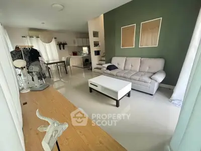 Spacious living room with modern decor and open layout in a stylish home.