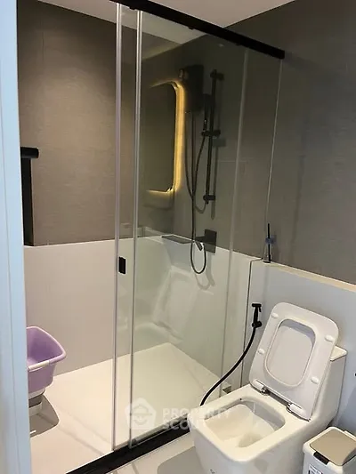 Modern bathroom with glass shower and sleek fixtures