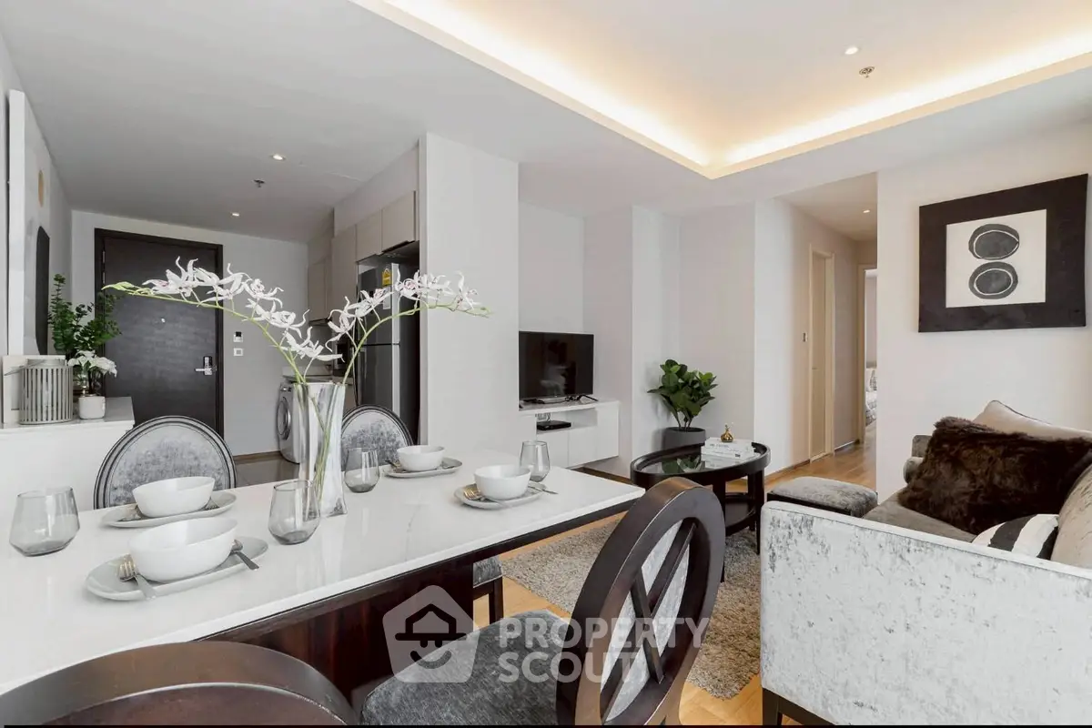 Modern living room with elegant dining area and stylish decor in a contemporary apartment.