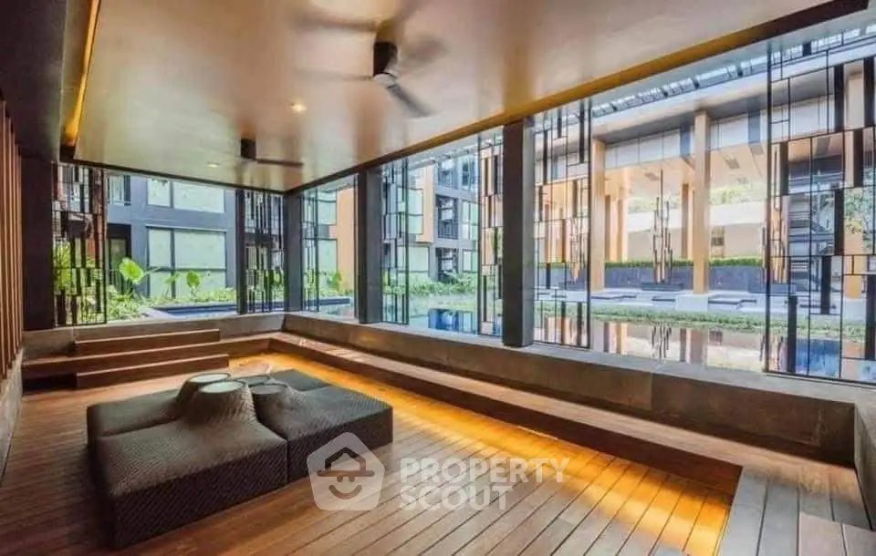 Luxurious modern living space with large windows and garden view