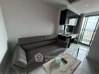 Modern living room with sleek sofa and city view from balcony