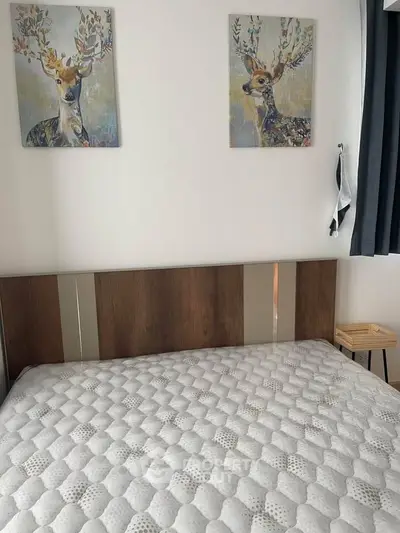 Cozy bedroom with stylish deer artwork and modern decor