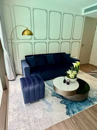 Stylish modern living room with blue velvet sofa and elegant decor