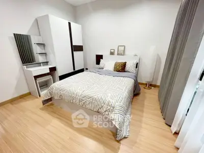 Modern bedroom with stylish decor and ample natural light