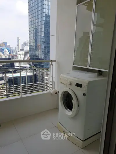 Modern balcony with washing machine and city skyline view