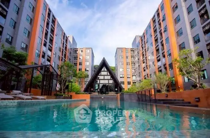 Luxurious apartment complex with stunning pool and modern architecture