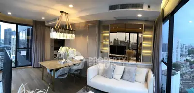 Luxurious modern living room with panoramic city views and elegant dining area.