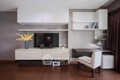 Modern living room with sleek white cabinetry and elegant decor