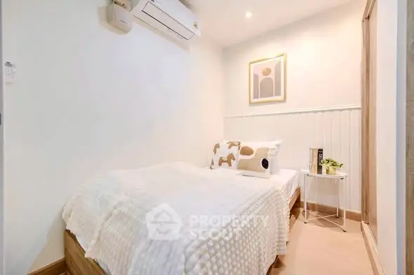 Cozy bedroom with modern decor and air conditioning