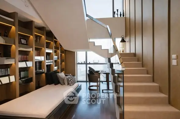 Luxurious modern living room with elegant staircase and built-in bookshelves, perfect for stylish urban living.