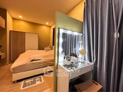 Cozy bedroom with modern decor and a stylish vanity setup, perfect for relaxation and comfort.