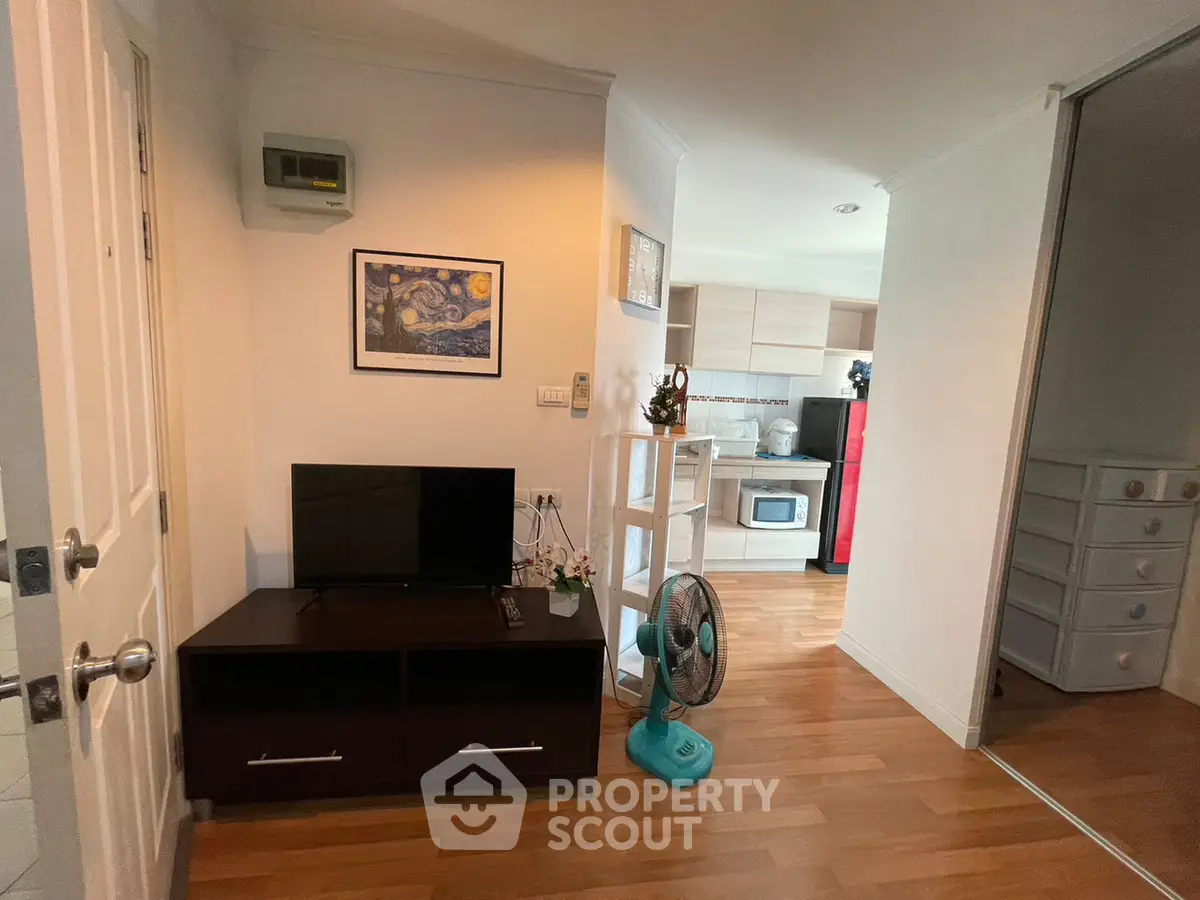 Charming apartment interior with cozy living area and modern kitchen, perfect for urban living.