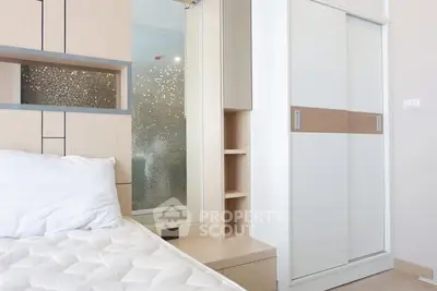 Modern bedroom with sleek sliding closet doors and stylish decor