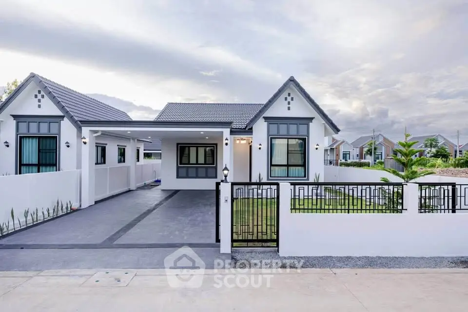 Charming modern house with spacious driveway and lush garden, perfect for family living.
