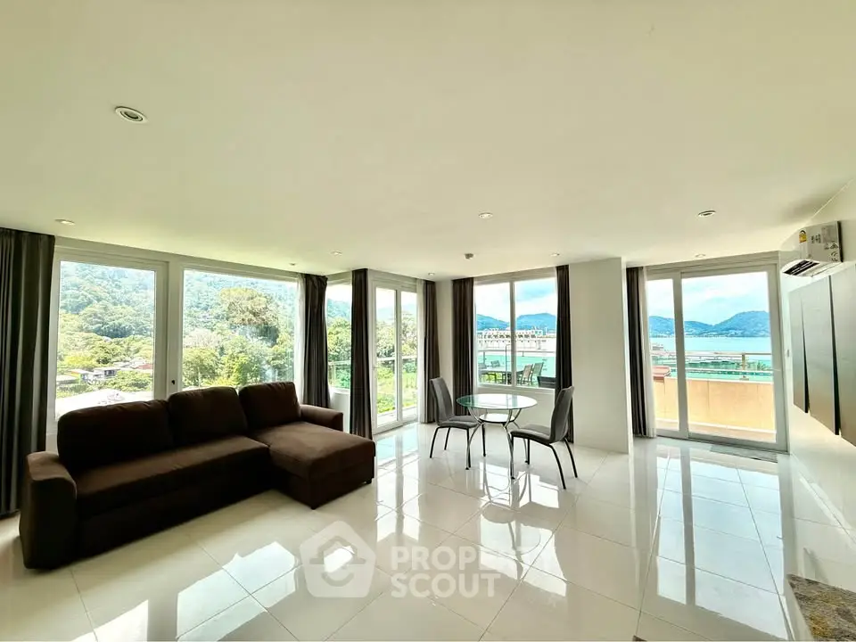Spacious living room with panoramic ocean view and modern furnishings