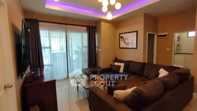 Modern living room with stylish lighting and cozy sectional sofa