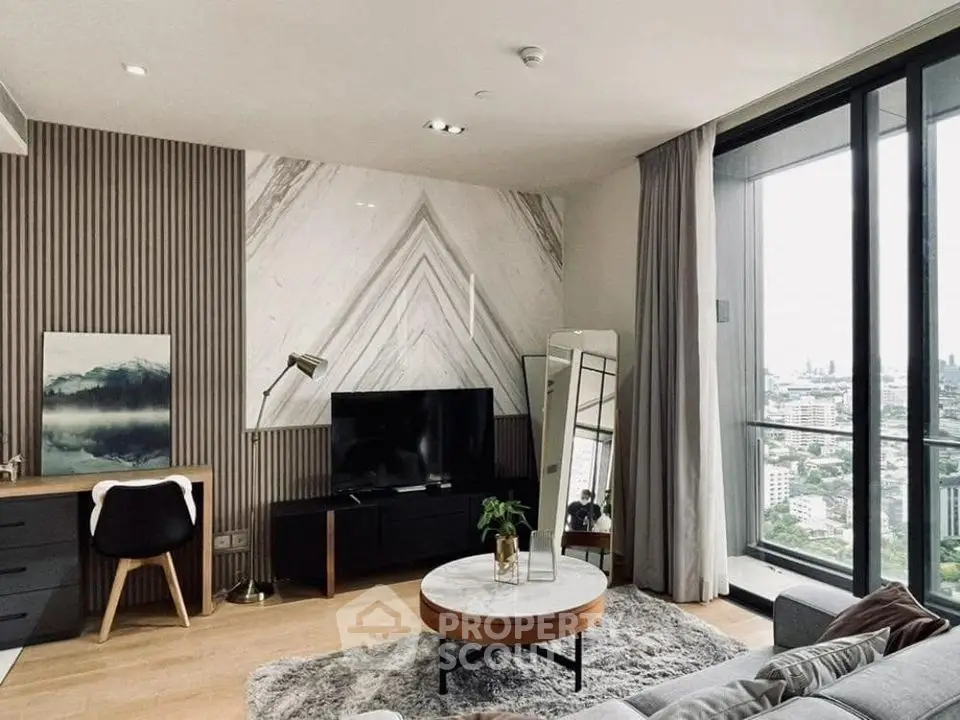 Modern living room with city view, stylish decor, and natural light.
