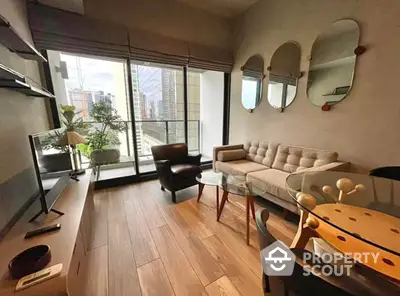 Chic urban living room with hardwood floors, modern furniture, and floor-to-ceiling windows offering a city view, perfect for cosmopolitan living.