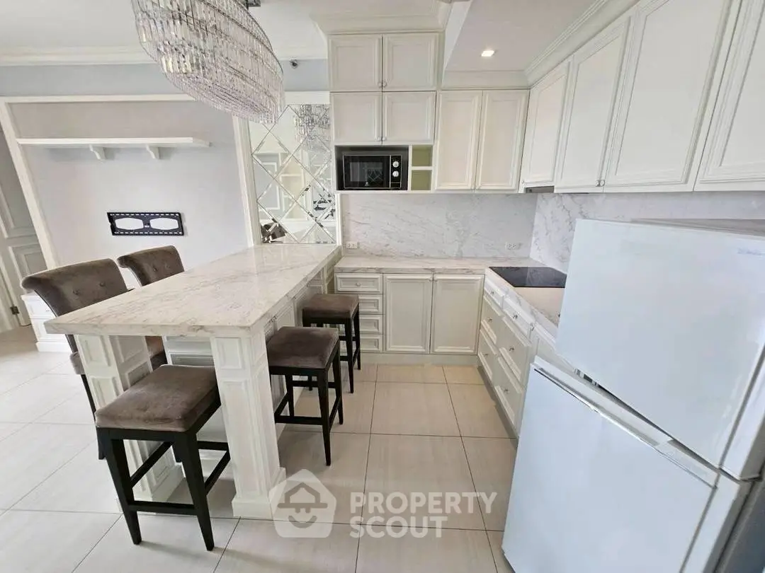 Luxurious kitchen with marble countertops and modern appliances in elegant home