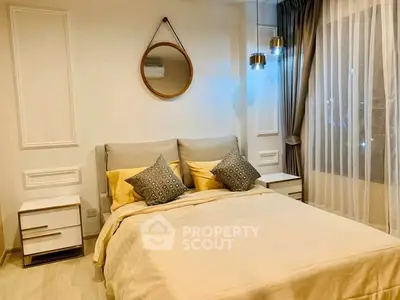 Elegant bedroom with modern decor, featuring a cozy bed, stylish lighting, and a large window with sheer curtains.