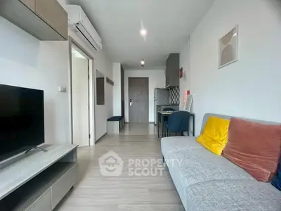 Modern living room with sleek furniture and air conditioning in a stylish apartment.