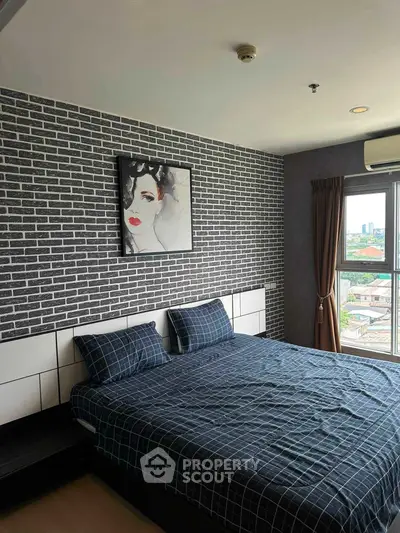 Stylish bedroom with modern brick accent wall and city view window.