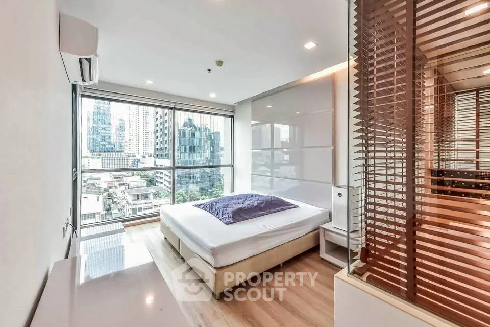 Modern bedroom with city view and stylish interior design