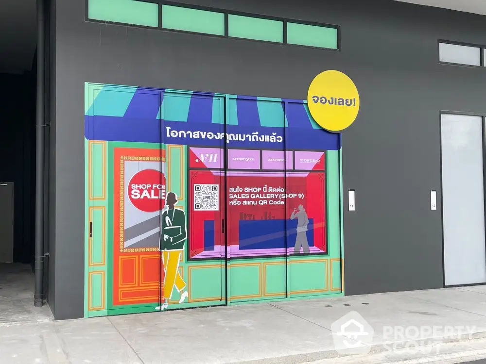 Colorful storefront with vibrant signage and sale promotion graphics.