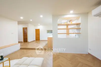 Spacious modern living room with open layout and wooden flooring