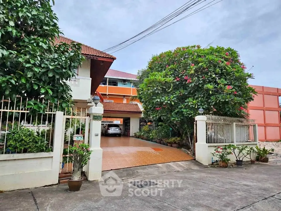 Charming residential property with lush garden and spacious driveway.