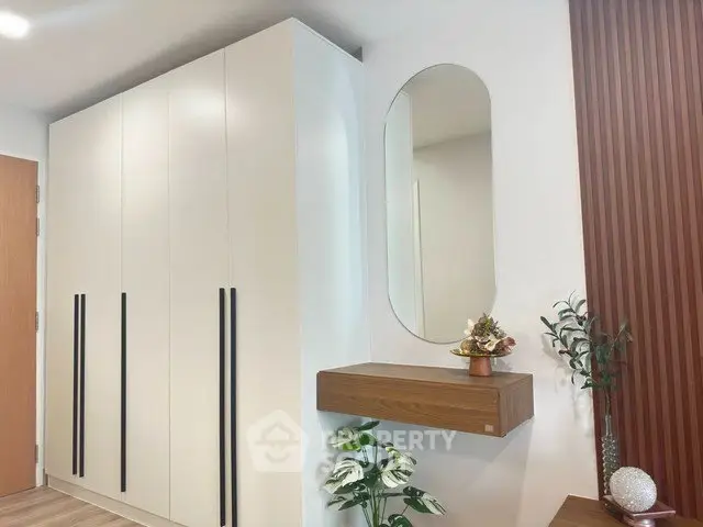 Modern interior with sleek wardrobe and stylish decor in a contemporary home setting.