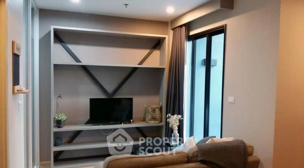 Modern living room with sleek shelving and cozy seating area