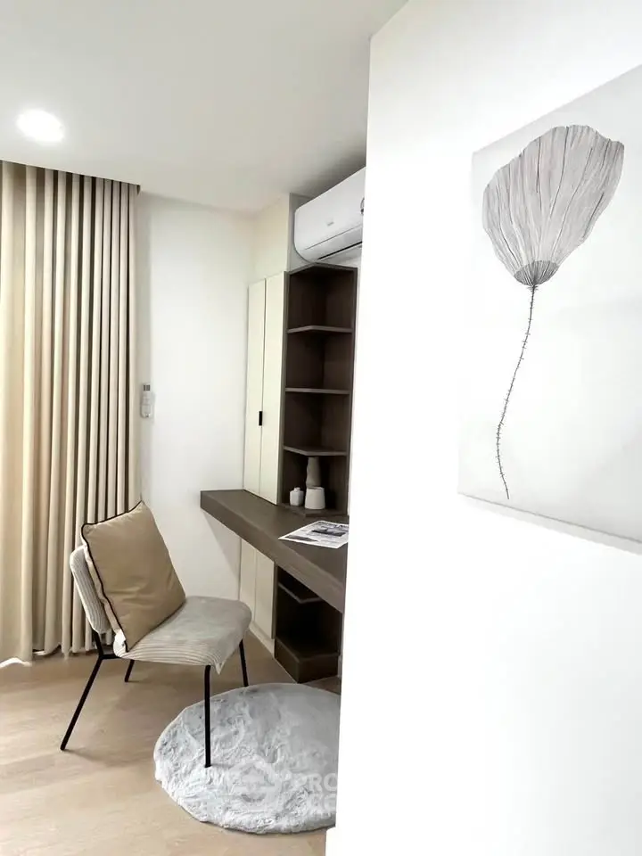 Modern study nook with stylish chair and minimalist decor in a bright apartment.