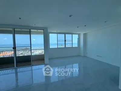 Spacious living room with stunning ocean view and large windows