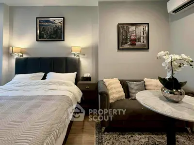 Chic bedroom with modern decor and cozy seating area