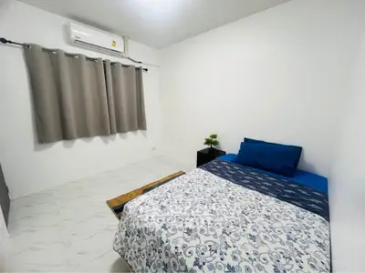 Cozy minimalist bedroom with air conditioning and modern decor