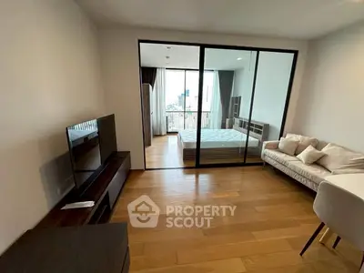 Modern studio apartment with glass partition and city view