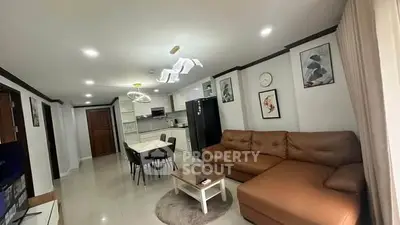 Spacious modern living room with open kitchen and stylish decor