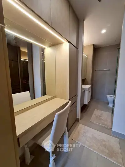 Modern bathroom with sleek vanity and elegant lighting