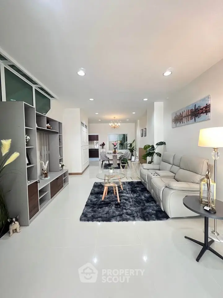 Modern living room with elegant decor and plush seating in a stylish open layout.